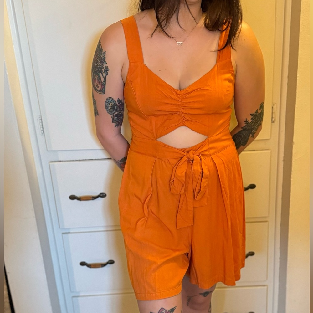 Super cute bright orange romper!